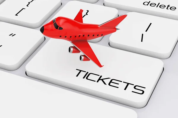 Röd tecknad leksak Jet flygplan över datorns tangentbord med biljetter — Stockfoto
