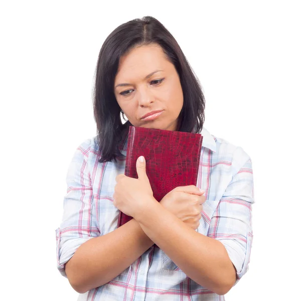 Sorg vackra unga College flicka anläggning boka i händer — Stockfoto