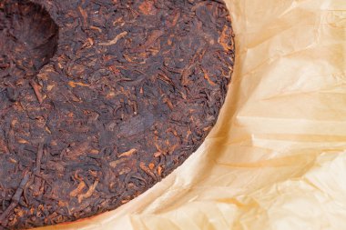 Geleneksel Çince Shu Puer veya Puerh çay yuvarlak düz disk
