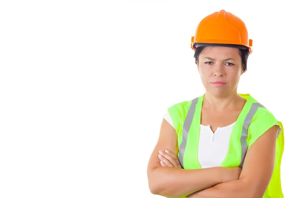 Ernsthafte attraktive Arbeiterin in Sicherheitsjacke und gelbem Helm — Stockfoto
