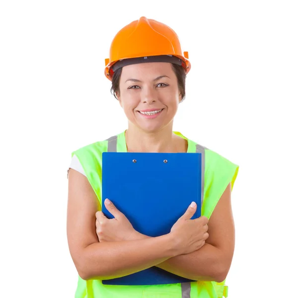 Atractiva mujer trabajadora en chaqueta de seguridad y casco amarillo Holdi — Foto de Stock
