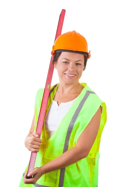 Attraktive Arbeiterin in Sicherheitsjacke und gelbem Helm mit — Stockfoto