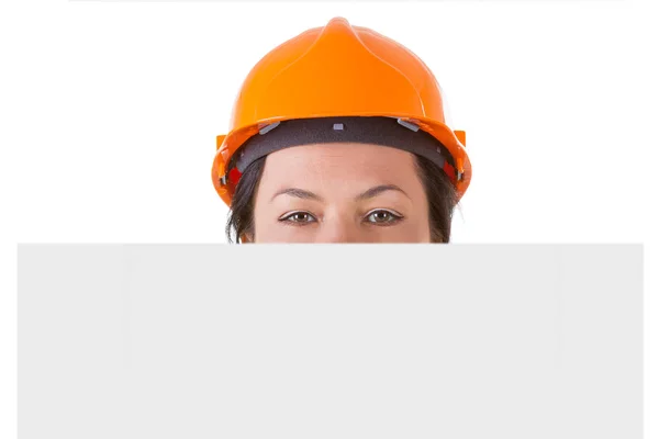 有魅力的女人工人在安全黄色头盔的空白纸 — 图库照片