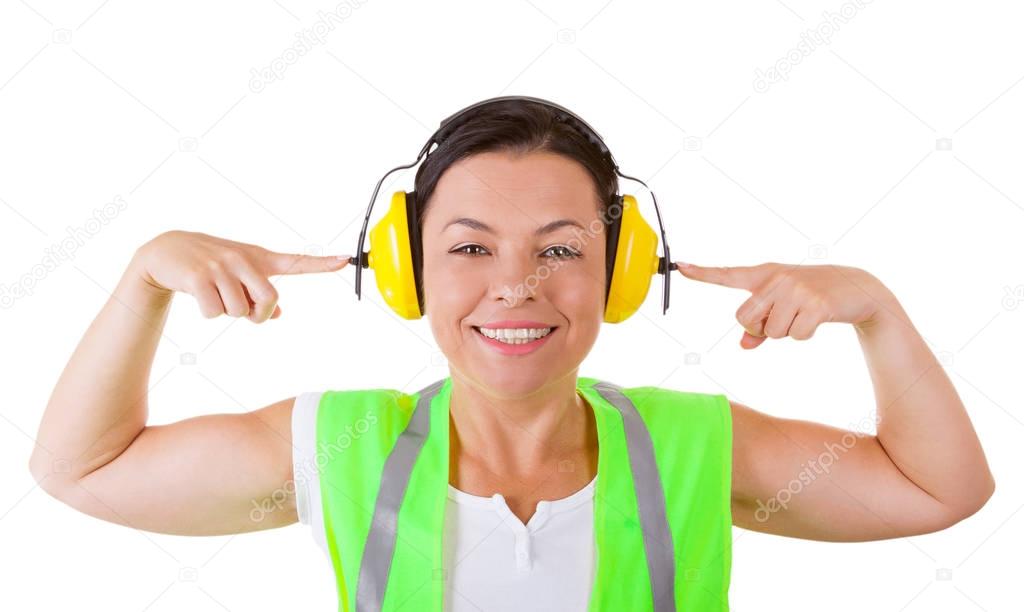 Attractive Woman Worker in Safety Jacket and Protective Ear Head