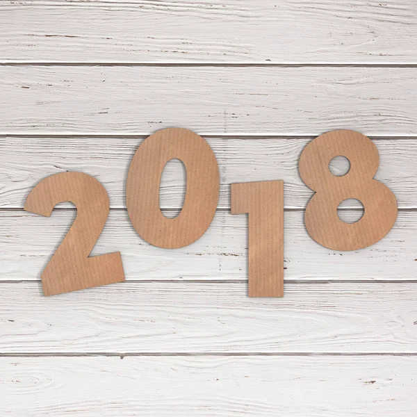 Cardstock Numbers 2018 Happy New Year Sign over table. 3d Render — Stock Photo, Image