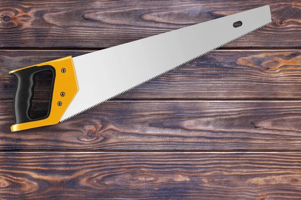 手锯工具在木桌上为您的设计提供自由空间. — 图库照片