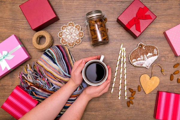 Holiday giftbox present packing flatlay with winter coffee, almond, spices, gingerbreads