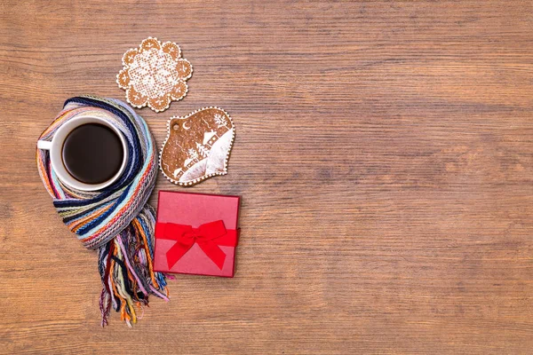 Holiday giftbox with winter coffee and gingerbreads