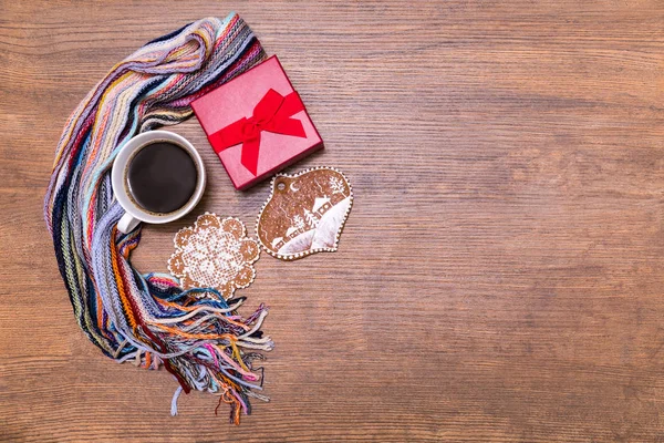 Holiday giftbox present packing flatlay with winter coffee, almond, spices, gingerbreads