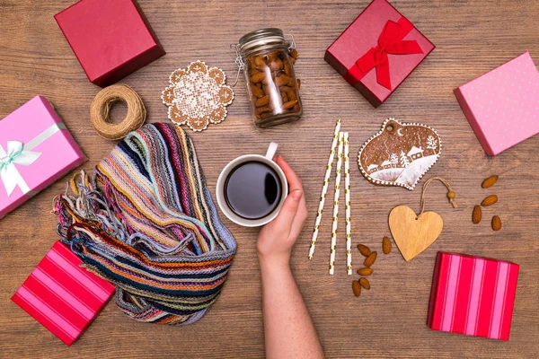 Holiday giftbox present packing flatlay with winter coffee, almond, spices, gingerbreads