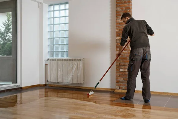 Lacquering Wood Floors Worker Uses Roller Coating Floors Varnishing Lacquering — Stock Photo, Image