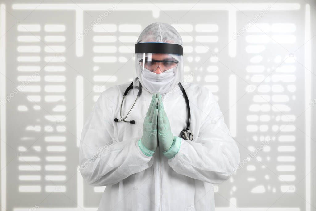 Doctor in PPE suit uniform has stress and pray in Coronavirus outbreak or Covid-19. Emotional stress of overworked doctor and medical care