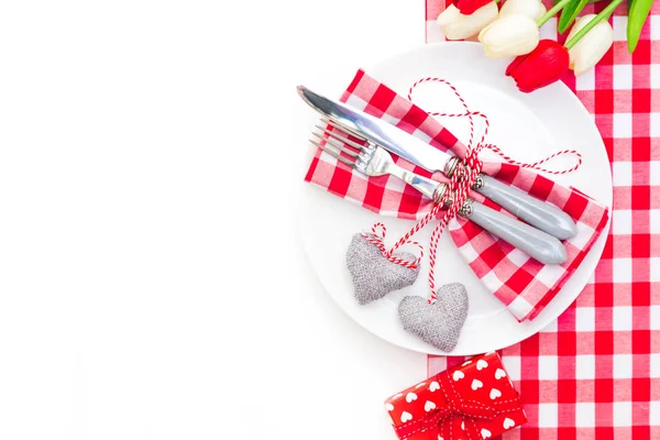 Love, valentine's day or eating concept with vintage cutlery, plate and plush heart on a wooden background. Top view with copy space — Stock Photo, Image