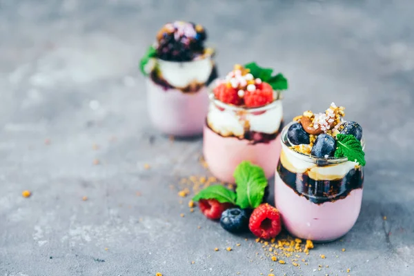 Assortment of creamy gourmet strawberry desserts — Stock Photo, Image