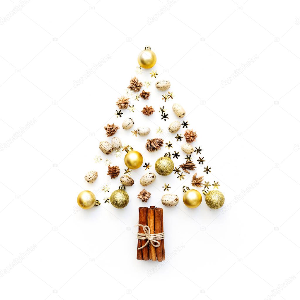 Christmas tree made from decorations on white background. holiday and celebration creative concept. New Year and Christmas postcard or invitation. Flat lay 