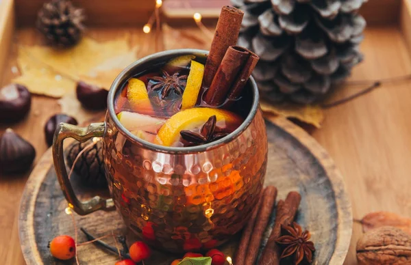 Cup of hot spicy tea with anise and cinnamon. Autumn composition.