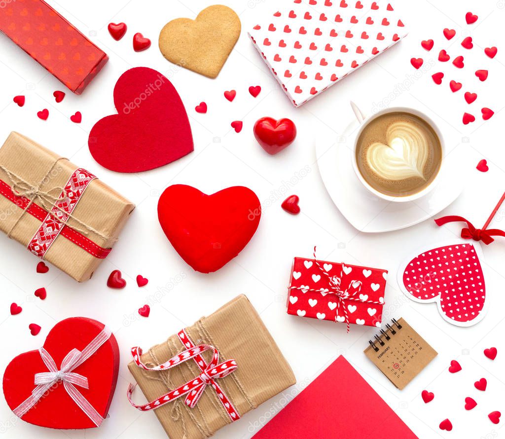 Cup of coffee and heart shaped cookies with gifts on white background. Happy valentine's day. Flat lay