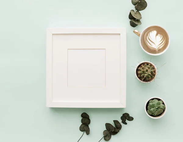 Mockup Neutral Minimalist Flat Lay Scene With coffee, frame and cactus