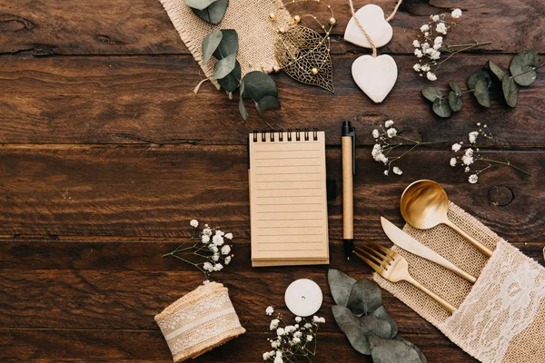Wedding planning concept. Flat lay composition with boho wedding decorations over wooden background. Top view, copy space
