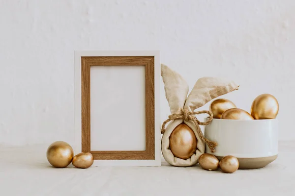 Mock Up Rustic Easter. Frame with gold eggs. Copy Space