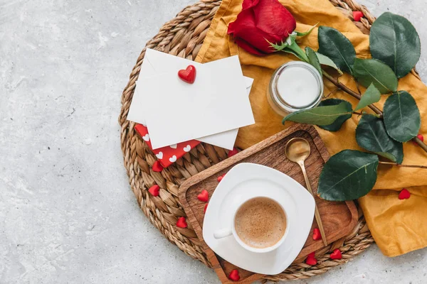 Flat Lay Valentines  concept, coffee cup, rose and a gift. Top view, flat lay