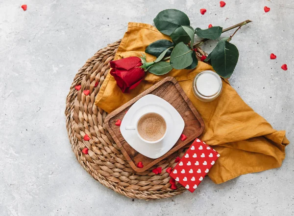 Flat Lay Valentines concept, coffee cup, rose and a gift. Top view, flat lay