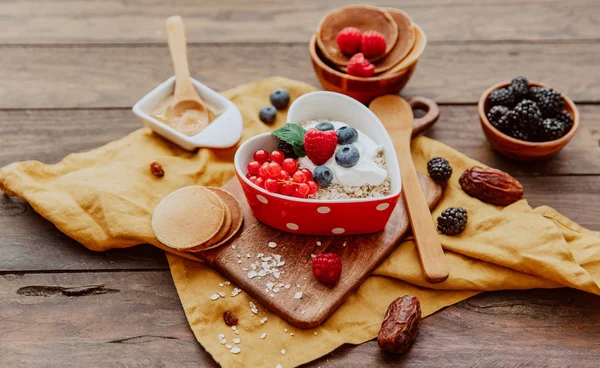 Oats Heart Shape Bowl Berries Wooden Table — Stock Photo, Image