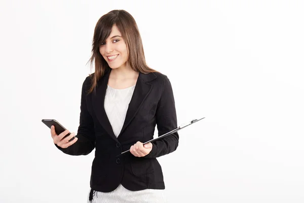 Young businesswoman using mobile shot in white background — Stock Photo, Image