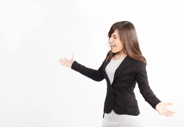 Young businesswoman with open arms shot in white background — Stock Photo, Image