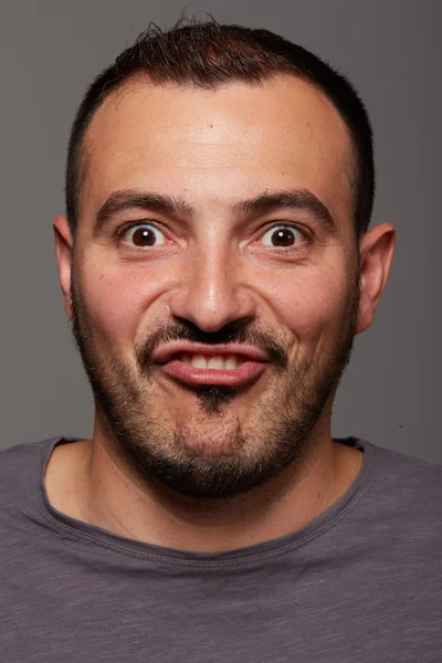 Man doing a funny facial expression — Stockfoto