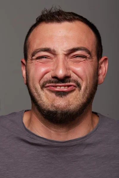 Man doing a funny facial expression — Stockfoto