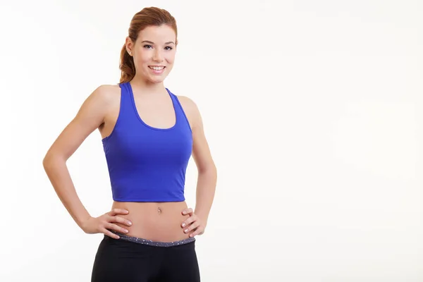Fit woman with her hands on hips — Stock Photo, Image