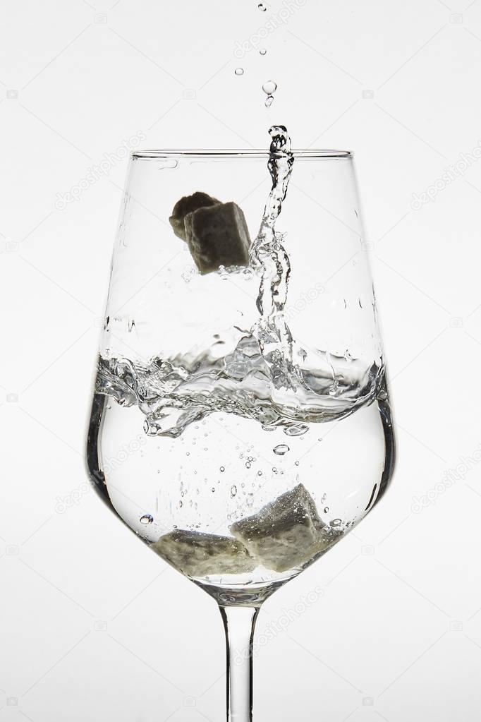 water poured into glass ON WHITE BACKGROUND