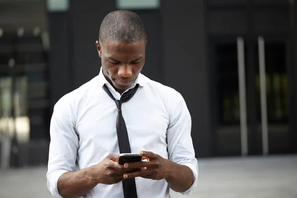 Young african american businessman using smart phone — Stock Photo, Image