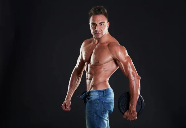 Handsome muscular fit young man on studio background — Stock Photo, Image