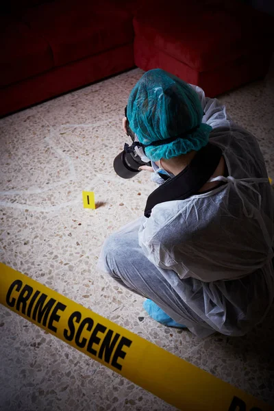 Forensics researcher photographing a blood  at a murder scene — Stock Photo, Image