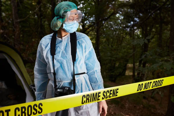 Forensics researcher photographing a blood  at a murder scene — Stock Photo, Image