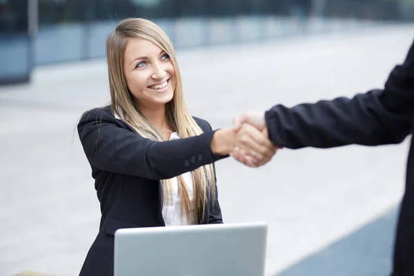 blond business woman handshake