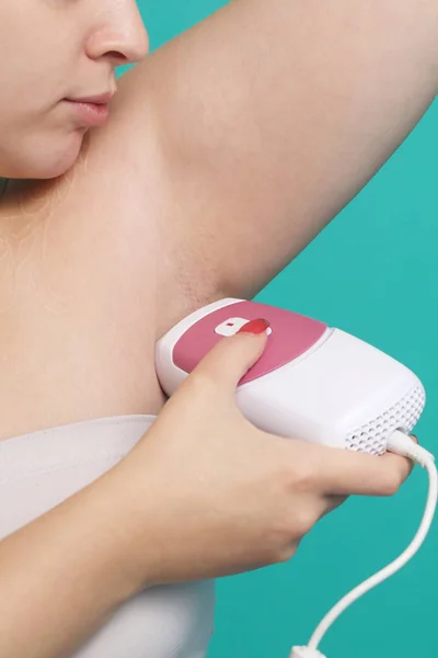 Removing armpit's Hair Of Young Woman