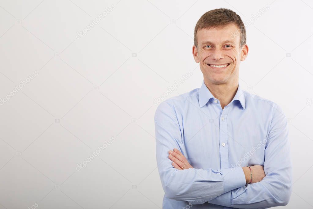 adult businessman posing in wall background