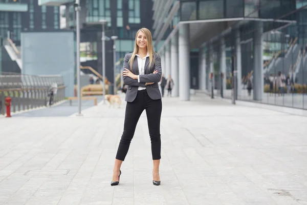 beautiful businesswoman walking in urban environment