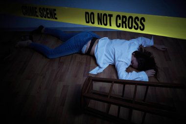 crime scene - woman lying dead on the floor