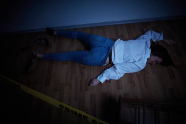 crime scene - woman lying dead on the floor