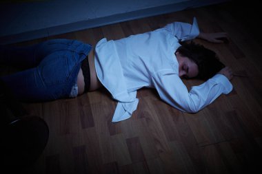 crime scene - woman lying dead on the floor