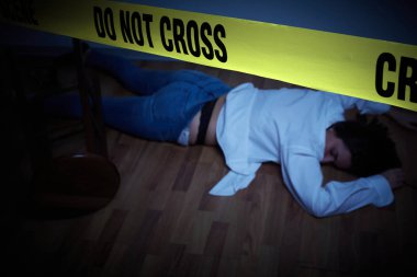 crime scene - woman lying dead on the floor