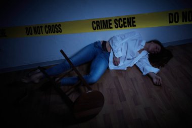 crime scene - woman lying dead on the floor