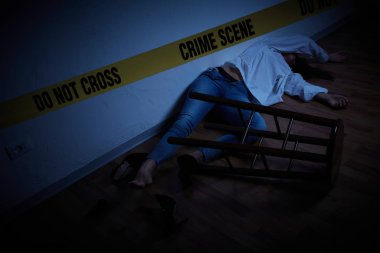 crime scene - woman lying dead on the floor