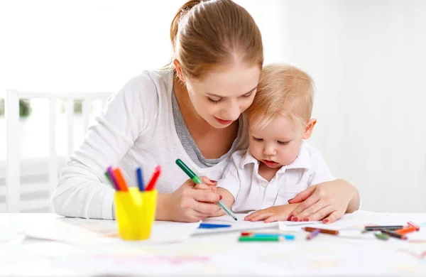 Mother with baby son with colored pencils Royalty Free Stock Photos