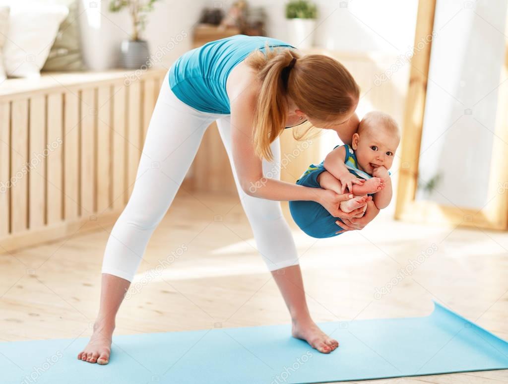 Mother is engaged in  fitness with baby