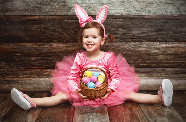 Happy fanny child girl in easter bunny costume with eggs — Stock Photo, Image